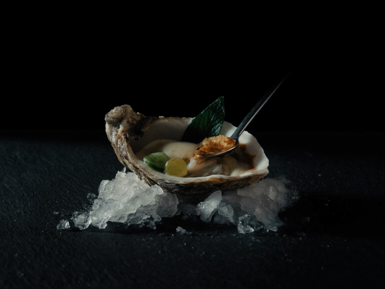 Gillardeau oyster on crushed ice with frozen cucumber and rye vinegar