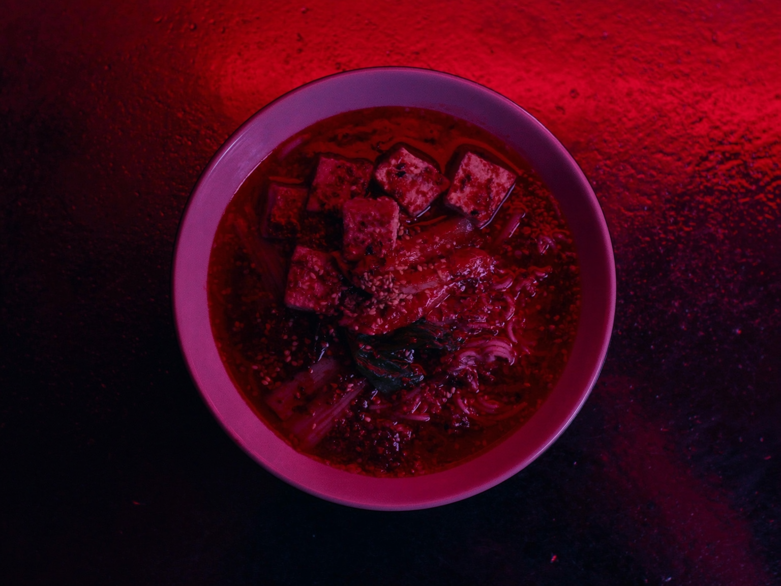 Fiery red vegan tantan ramen with chili crisp and smoked tofu