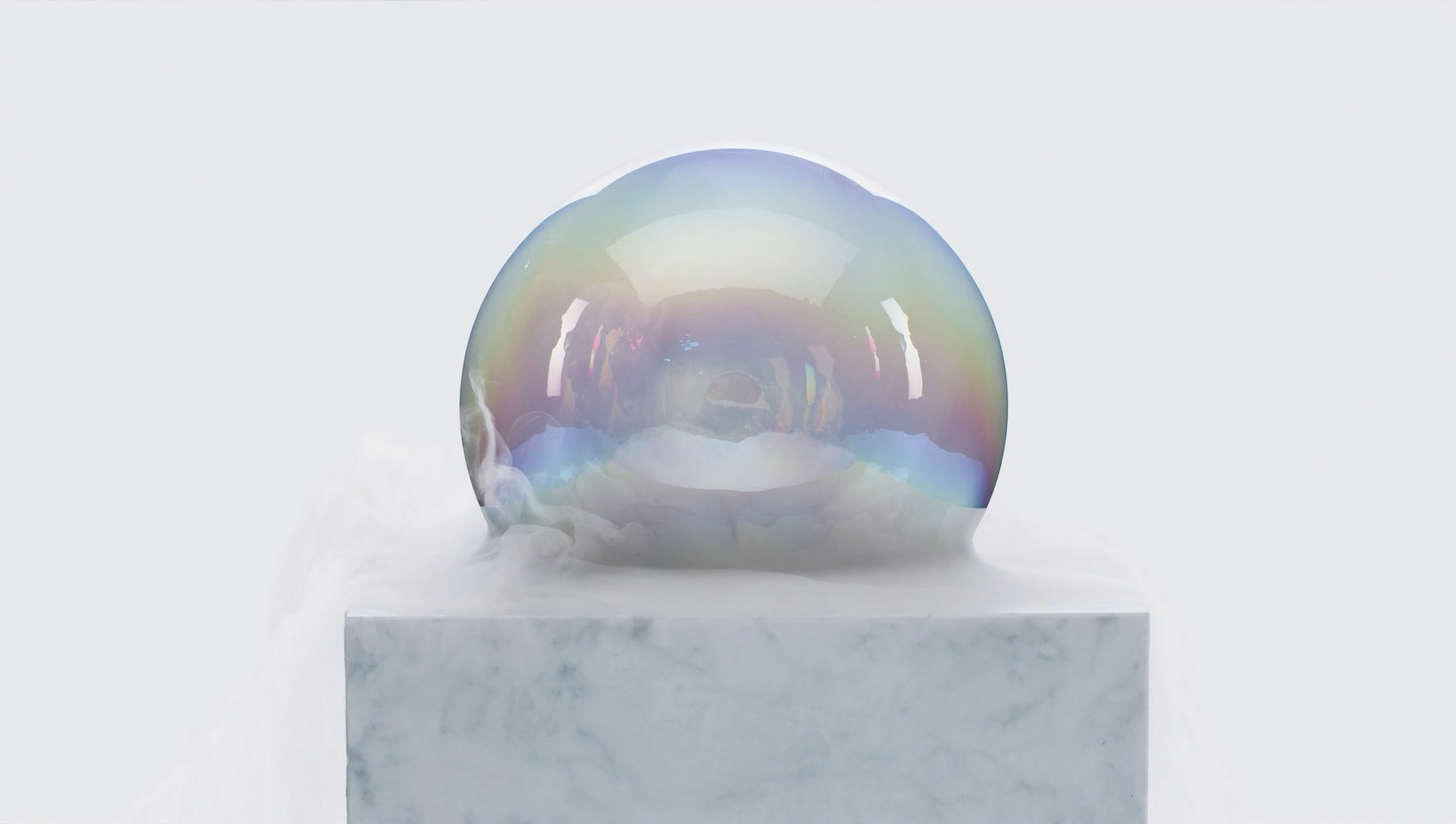 An iridescent glass-like sphere dessert on a white pedestal, wreathed in nitrogen vapor