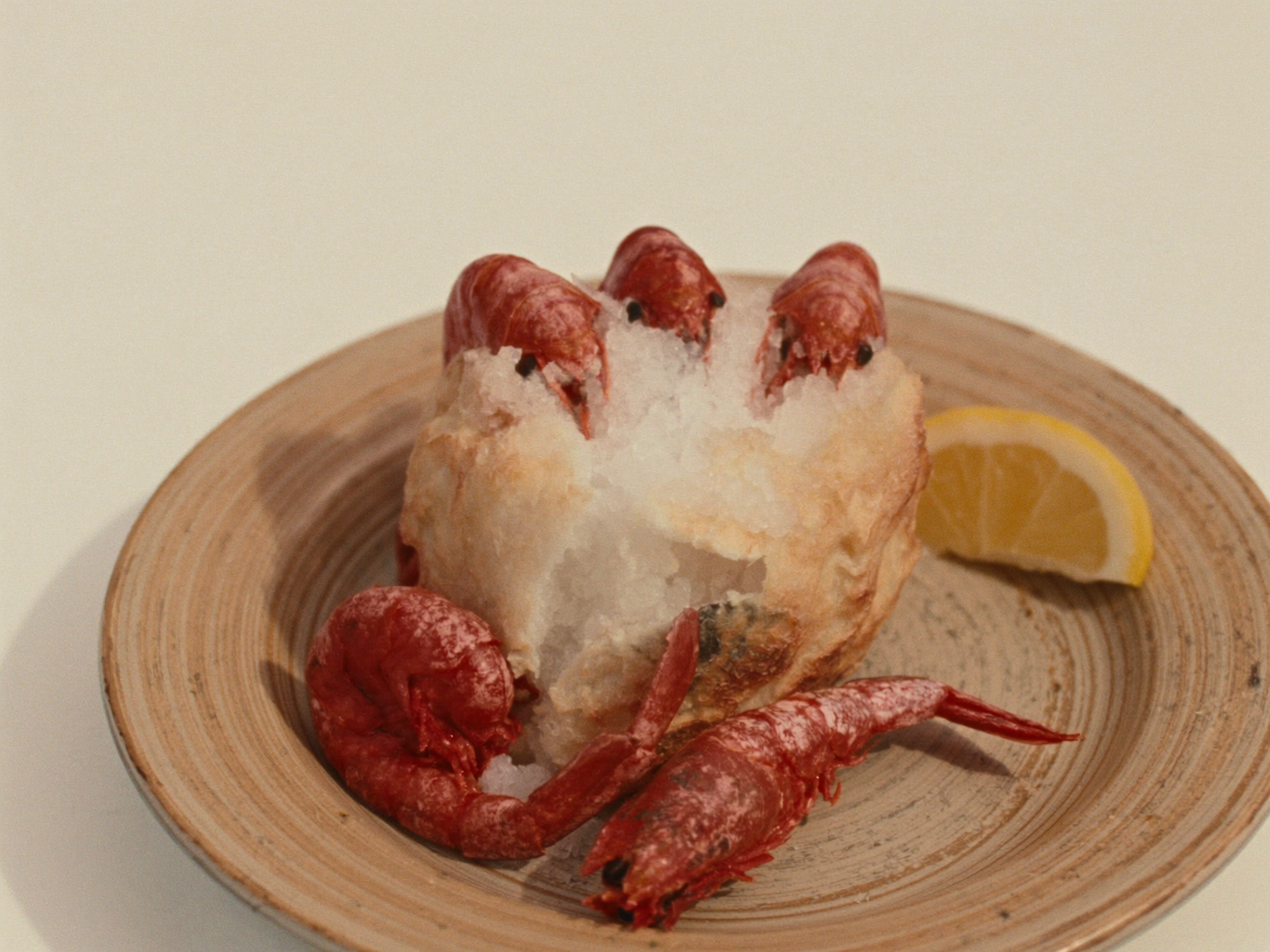 Red prawns in a cracked salt crust with lemon